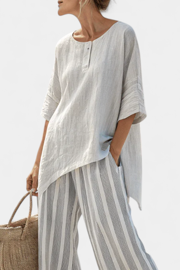Lada – Stylish Asymmetrical Shirt Paired with Striped Pants