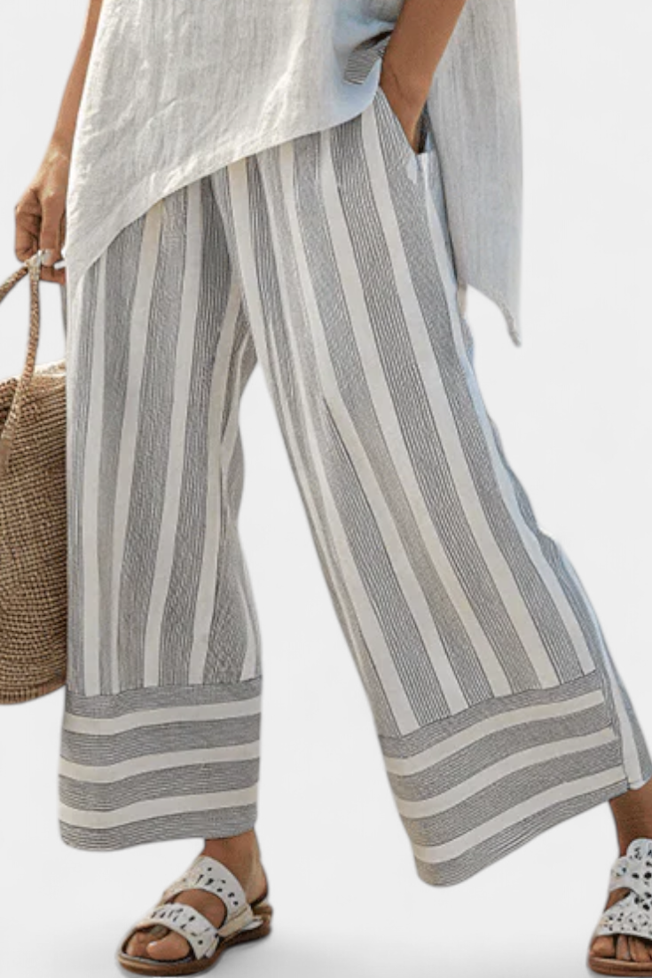 Lada – Stylish Asymmetrical Shirt Paired with Striped Pants