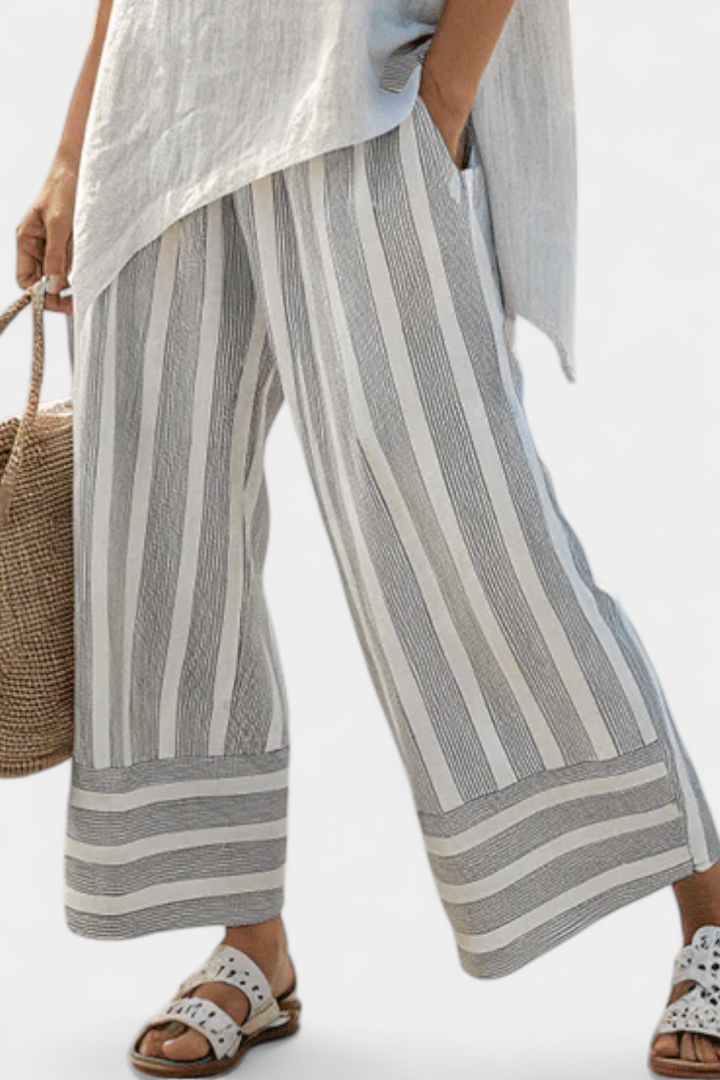 Lada – Stylish Asymmetrical Shirt Paired with Striped Pants